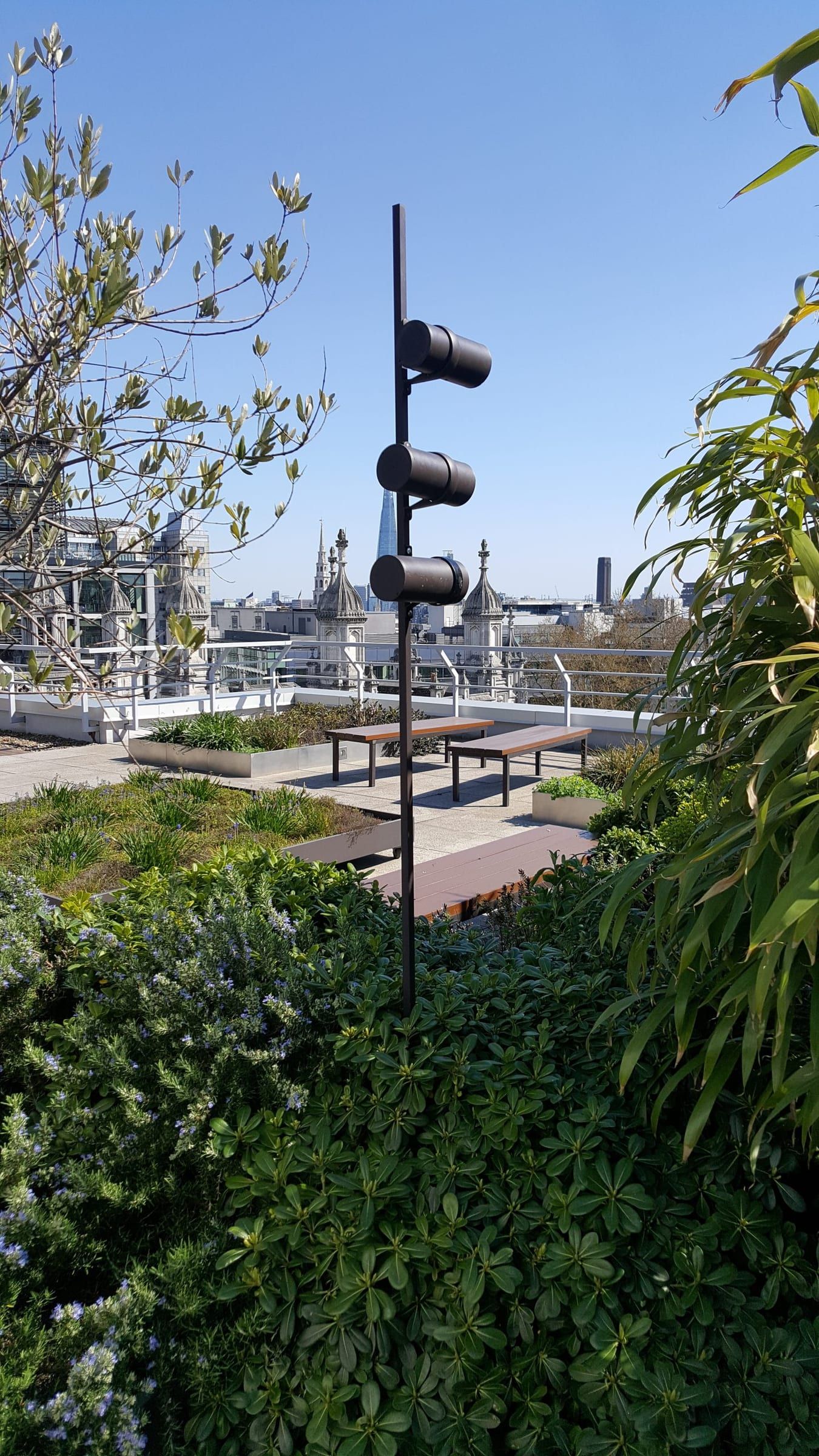 Bee hotels attached to poles on the terrace